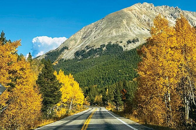 Canoeing on a clear lake surrounded by mountains